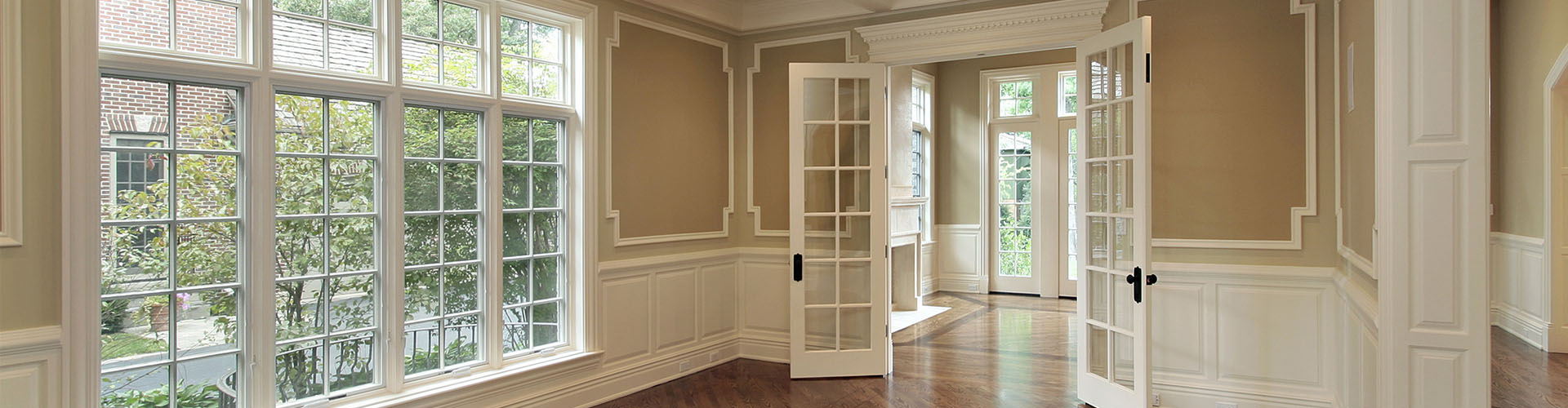empty house interior featuring windows and doors