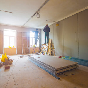 New Construction Window Installation, Working process of installing metal frames for plasterboard (drywall) for making gypsum walls with ladder and tools in apartment is under construction, remodeling, renovation, extension, restoration and reconstruction