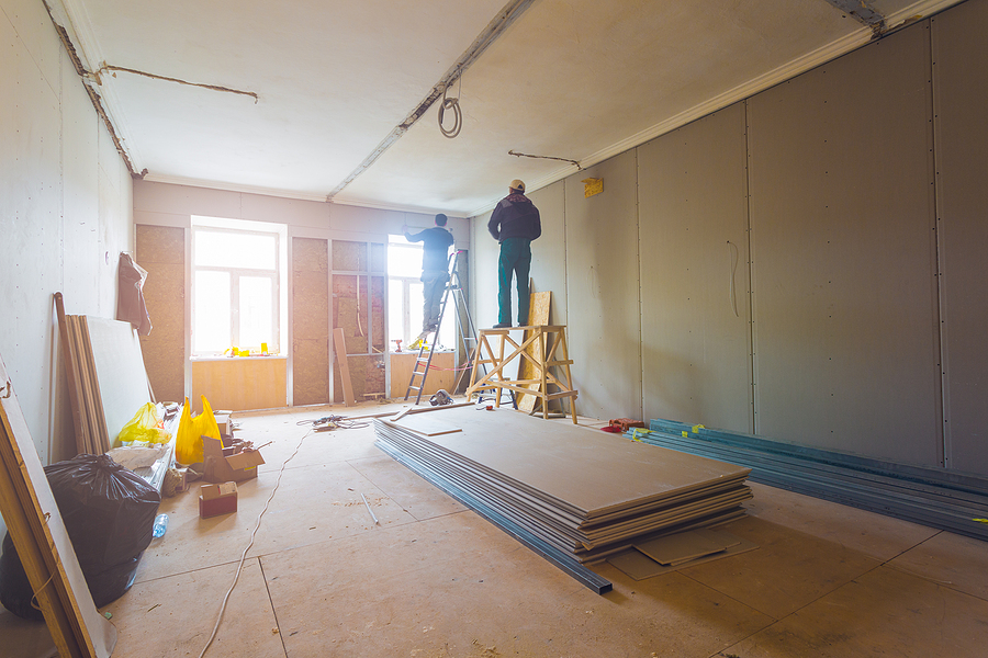 New Construction Window Installation, Working process of installing metal frames for plasterboard (drywall) for making gypsum walls with ladder and tools in apartment is under construction, remodeling, renovation, extension, restoration and reconstruction