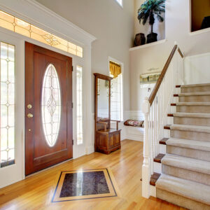 Professional Doors Installation Services , Nice entry way to home with carpet staircase and white interior.