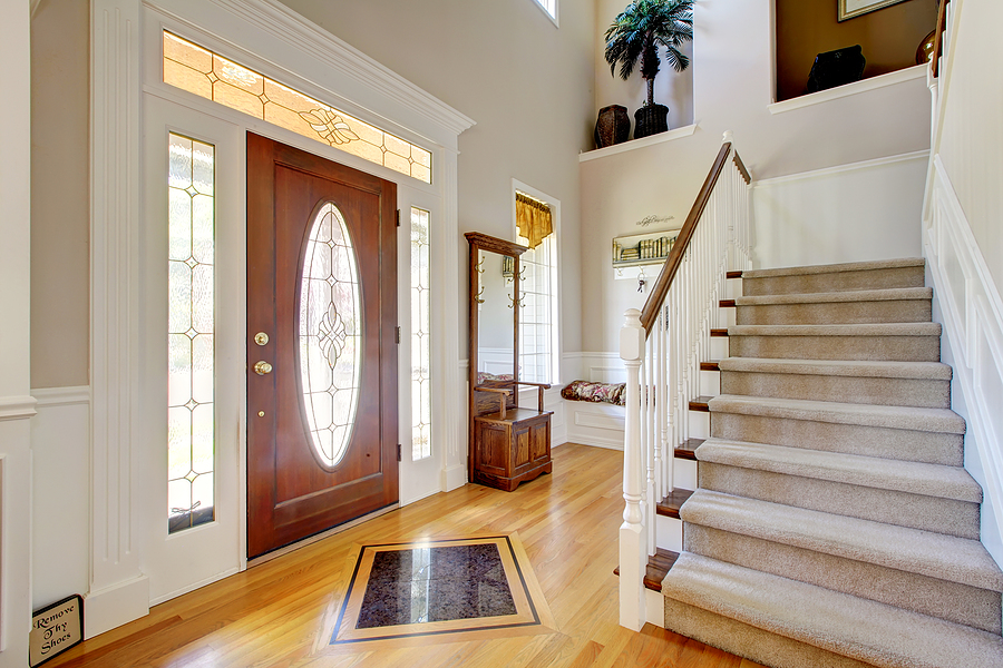Professional Doors Installation Services , Nice entry way to home with carpet staircase and white interior.